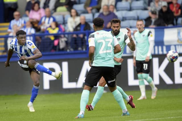 At the double: Fisayo Dele-Bashiru strikes Wednesday into a 2-1 lead against Portsmouth and was called on again to fire home an equaliser deep into the second half of the League One opener. (Picture: Steve Ellis)