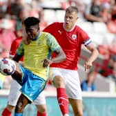 UP FOR IT: Mads Andersen (right) in action against Nottingham Forest's Taiwo Awoniyi during a pre-season Friendly at Oakwell earlier this month. Picture: Nigel Roddis/Getty Images