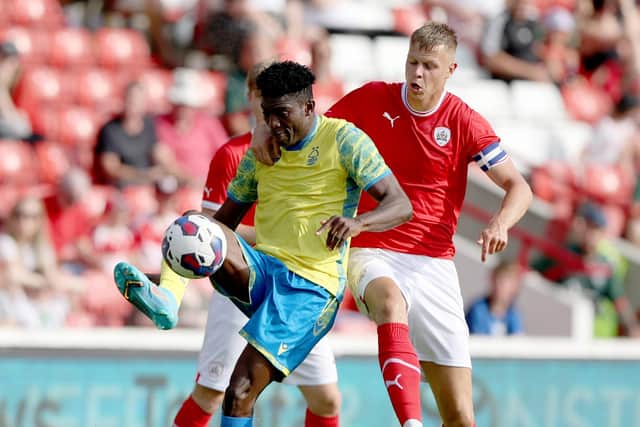 UP FOR IT: Mads Andersen (right) in action against Nottingham Forest's Taiwo Awoniyi during a pre-season Friendly at Oakwell earlier this month. Picture: Nigel Roddis/Getty Images