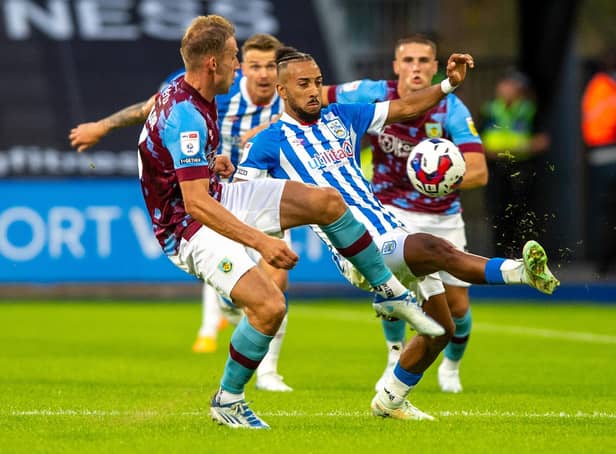 Huddersfield Town winger Sorba Thomas challenges Burnley defender and former Leeds United player Charlie Taylor. Picture: Bruce Rollinson.