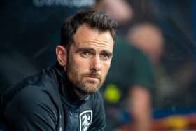 Pensive Huddersfield Town head coach Danny Schofield, pictured in the dug-out on his first match in full-time charge against Burnley on Friday night. Picture: Bruce Rollinson.