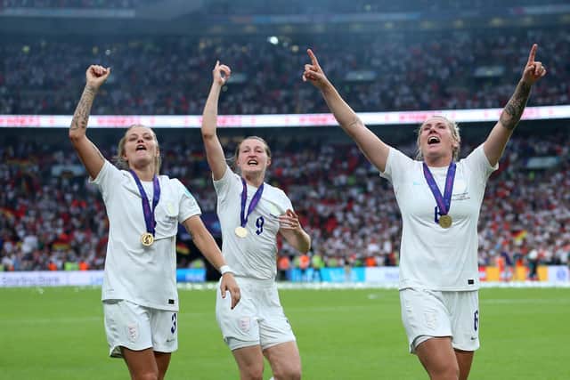 We've done it! England's Rachel Daly, left, Ellen White and Millie Bright celebrate the Wembley win. Picture: Nigel French/PA Wire.