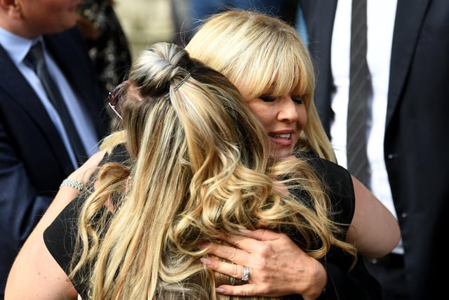 Former ITV Calendar presenter Christine Talbot hugs a friend outside the Minster.
