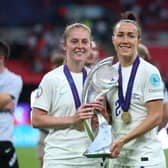 Just the start: England's Keira Walsh (left) and Lucy Bronze celebrate with the trophy after England win the UEFA Women's Euro 2022 final - now Bronze wants to add the World Cup, too. Picture: Nigel French/PA Wire.