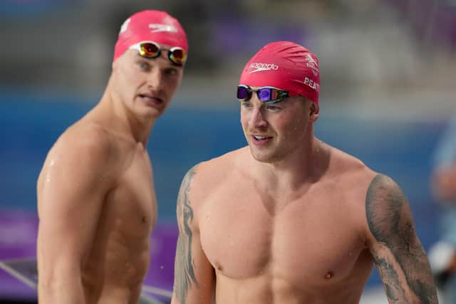 England's Adam Peaty and  James Wilby (right) look on after the Men's 50m Breaststroke Semi Final at Sandwell Aquatics Centre in Birmingham. Picture: Martin Rickett/PA