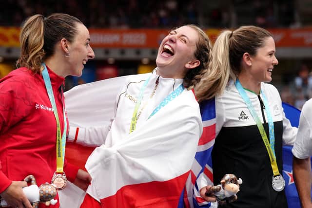 England's Laura Kenny (centre) laughs with her gold medal, alongside New Zealand's Michaela Drummond (right) with silver and Canada's Maggie Coles-Lyster with bronze. Picture: John Walton/PA