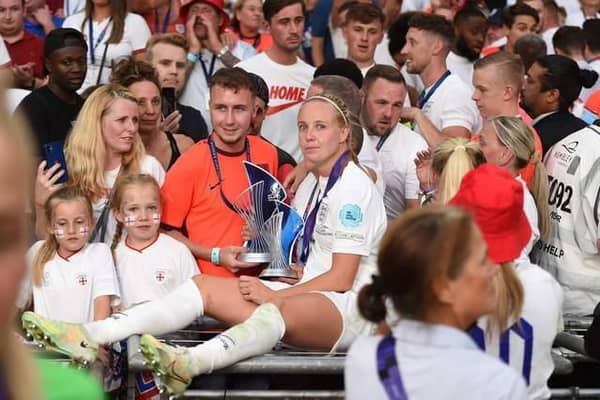 Beth Mead celebrates with their family with the Top Goalscorer and Player of the Tournament awards after the final whistle of the UEFA Women's Euro 2022 final