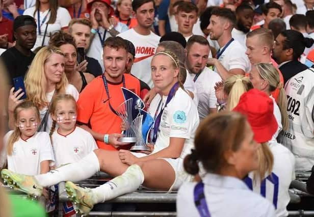 Beth Mead celebrates with their family with the Top Goalscorer and Player of the Tournament awards after the final whistle of the UEFA Women's Euro 2022 final