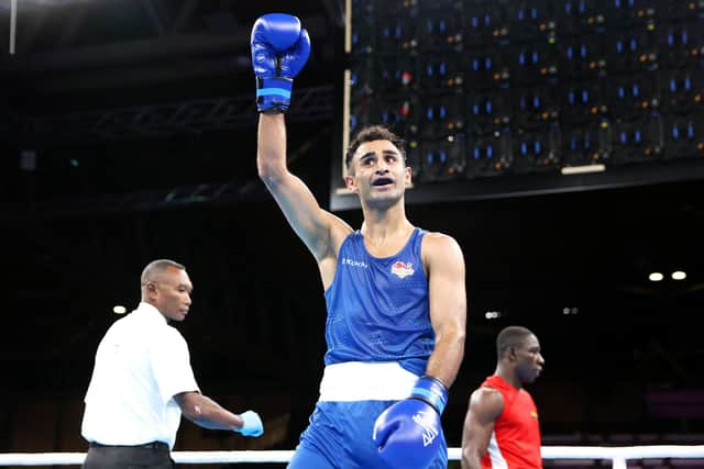 BIRMINGHAM, ENGLAND - AUGUST 02: Mohammed Harris Akbar of Team England celebrates victory in the Men's Over 67kg-71kg (Light Middle) - Round of 16 fight on day five of the Birmingham 2022 Commonwealth Games at NEC Arena on August 02, 2022 in Birmingham, England. (Photo by Luke Walker/Getty Images)