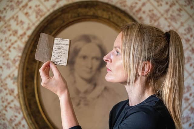 Bronte Parsonage Museum Curator Sarah Laycock with Charlotte Bronte's 'A Book of Rhymes'. Photo: Bruce Rollinson