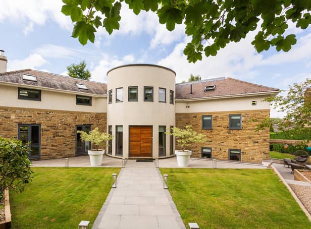 This house on Duchy Road is a highly individual contemporary family house which occupies a particularly private gated plot just off Dutchy Road, surrounded by mature gardens.