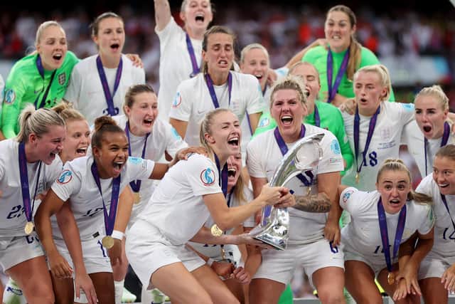 Leah Williamson and Millie Bright of England lift the UEFA Women's EURO 2022 Trophy after their sides victory during the UEFA Women's Euro 2022 final match between England and Germany at Wembley. (Picture: Naomi Baker/Getty Images)