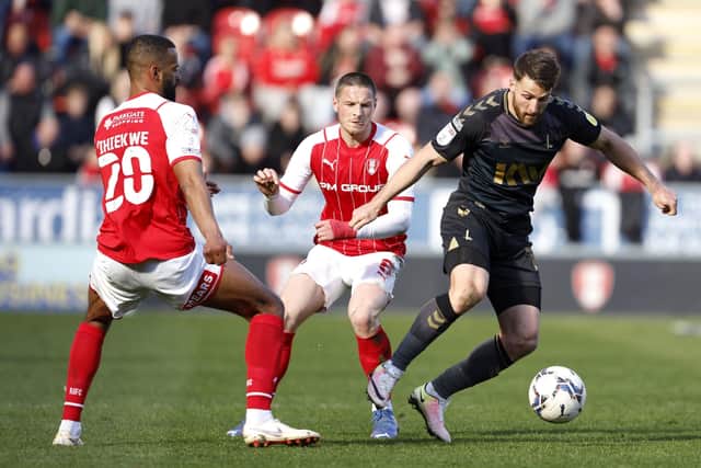 Charlton Athletic's Conor Washington (right) battles for the ball with Rotherham United's Michael Ihiekwe (left) and Ben Wiles during the Sky Bet League One match at the AESSEAL New York Stadium in March. Washington joined the Millers in the summer (PIcture: PA)