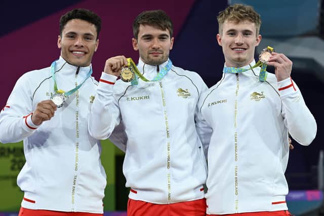 Team England 1-2-3: Silver medallist Jordan Houlden (L), gold medallist Daniel Goodfellow (C) and bronze medallist Jack Laugher pose with their medals during the presentation ceremony for the men's 3m springboard diving final. (Picture: Andy Buchanan / AFP)