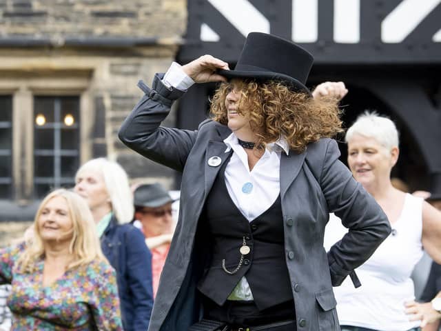 The Gentleman Jack flash mob perform in front of Shibden Hall.