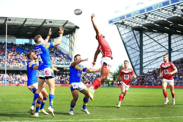 Leeds Rhinos and Salford Red Devils are two of the sides in the hunt for the play-offs. (Picture: SWPix.com)