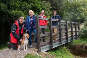 From left, Ellingstring resident Richard King with Merlin the dog, County Councillor Margaret Atkinson, Andrew McLean, public rights of way field officer, and Michael Leah, assistant director for Travel, Environment and Countryside Services, at Swinney Beck Bridge.