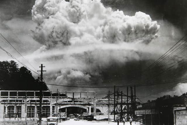 The radioactive plume from the bomb dropped on Nagasaki City, as seen from 9.6 km away, in Koyagi-jima, Japan, August 9, 1945. Photo by Hiromichi Matsuda/Handout from Nagasaki Atomic Bomb Museum/Getty Images