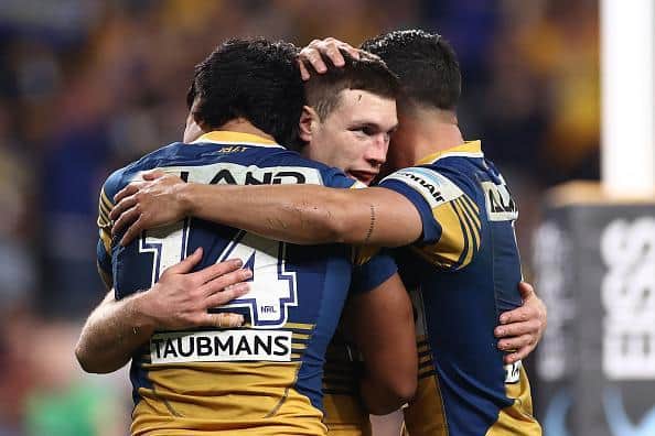 Tom Opacic, centre, celebrates a try. (Picture: Getty)