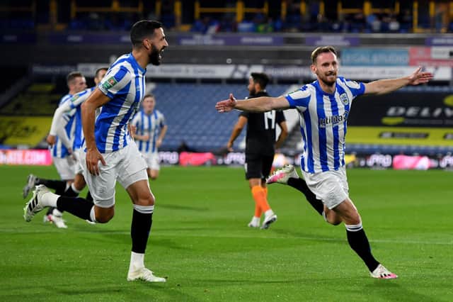 Up for it: Huddersfield Town defender Tom Lees says the squad are determined to get backj up the table after a poor start. Picture: Anthony Devlin/PA Wire.
