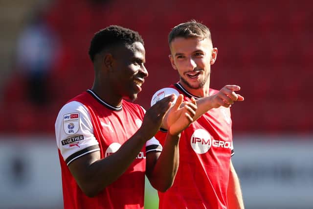 Rotherham United's Chiedozie Ogbene (left) and Dan Barlaser applaud the fans (Picture: PA)