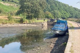 A stranded boat on the Huddersfield Narrow Canal