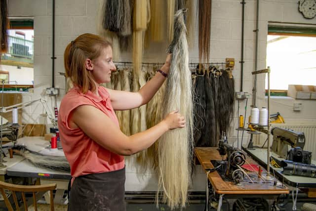 Rowena Morris selecting the real horse hair for a newly made horse at the Rocking Horse Shop, in Fangfoss, York. Picture Tony Johnson