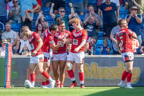 Picture by Allan McKenzie/SWpix.com - 13/08/2022 - Rugby League - Betfred Super League Round 23 - Salford Red Devils v Huddersfield Giants - AJ Bell Stadium, Salford, England - Salford's Harvey Livett (r) is congratulated on scoring a try against Huddersfield.