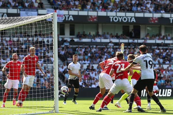 Barnsley's Conor McCarthy scores an own goal, Derby County's first of the game during the Sky Bet League One match at Pride Park Stadium. Picture: Nigel French/PA Wire.