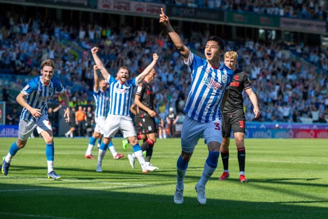 Yuta Nakayama heads Huddersfield Town in front against Stoke City to crown an excellent full league debut. Picture: Bruce Rollinson.