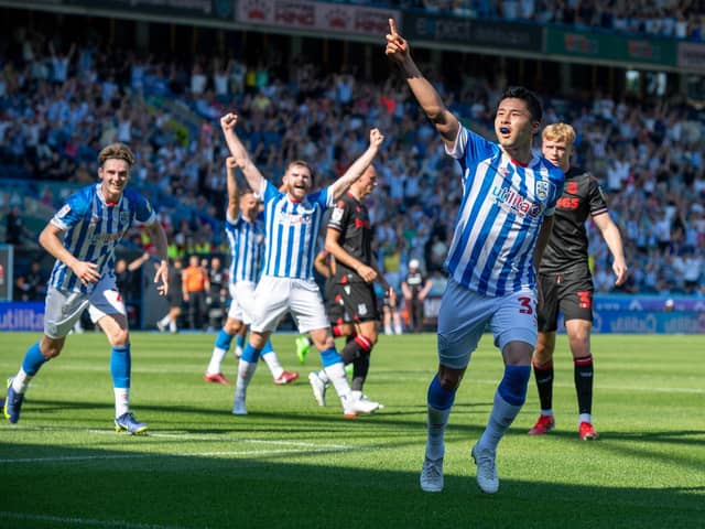Yuta Nakayama heads Huddersfield Town in front against Stoke City to crown an excellent full league debut. Picture: Bruce Rollinson.