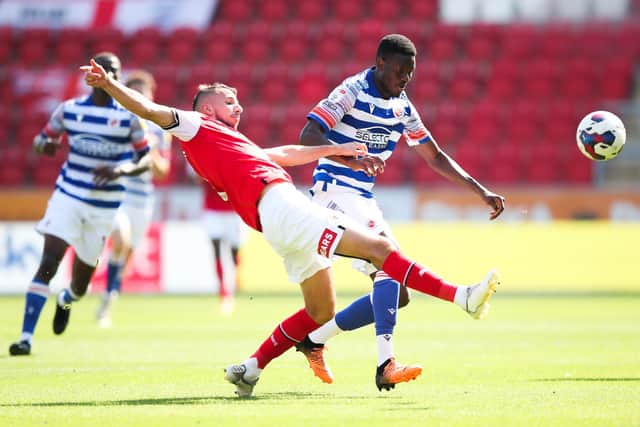Rotherham United's Dan Barlaser (left) and Reading's Mamadou Loum battle for the ball (Picture: PA)