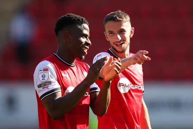Rotherham United's Chiedozie Ogbene (left) and Dan Barlaser applaud the fans following the rout of Reading on Saturday (Picture: PA)