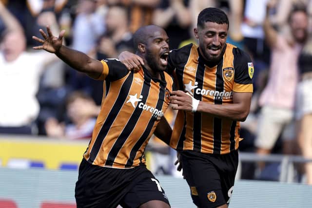 Hull City's Oscar Estupinan celebrates scoring their side's second goal of the game with team-mate Allahyar Sayyadmanesh as Norwich were beaten on Saturday (Picture: PA)