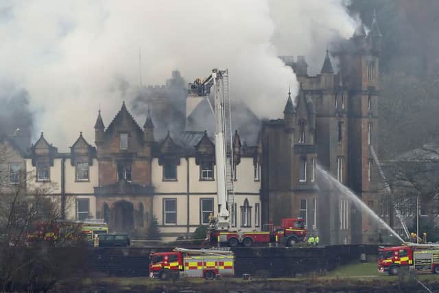 Firefighters at the scene following a fire at the Cameron House Hotel on the banks of Loch Lomond in Scotland, in 2017