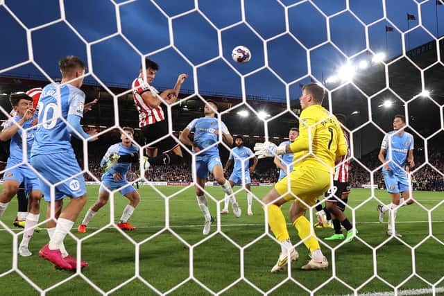 Sheffield United’s Anel Ahmedhodzic leaps highest to head in the opening goal against Sunderland in the Championship at Bramall Lane. Picture: Darren Staples/Sportimage