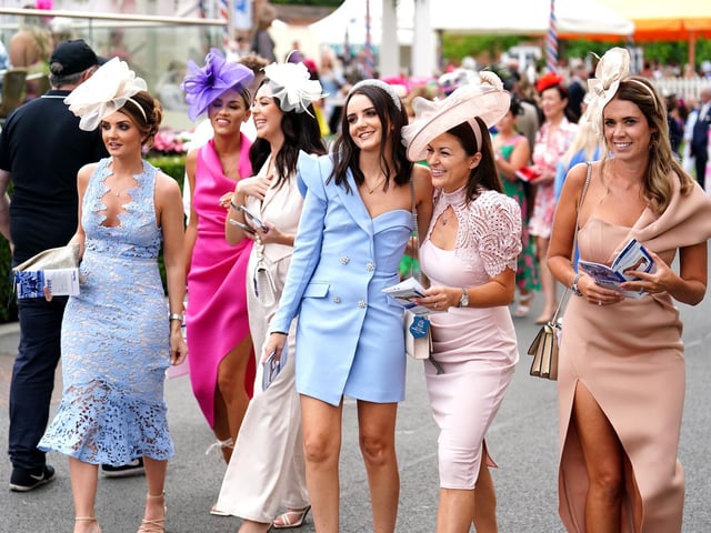 Racegoers arrive during day two of the Ebor Festival at York Racecourse.