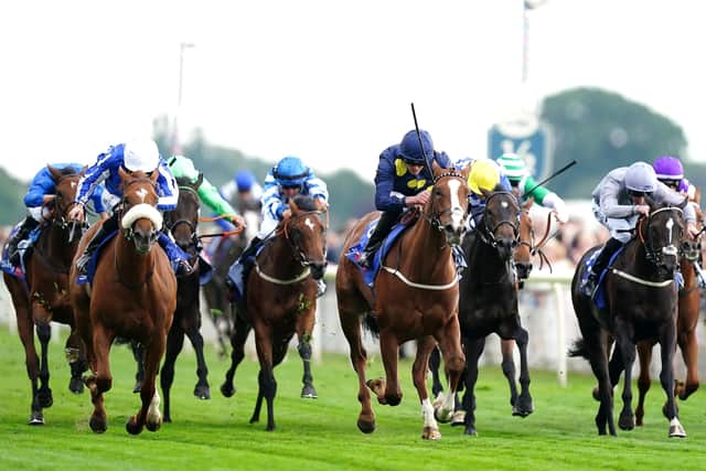 In the swing: Swingalong ridden by jockey Clifford Lee (centre) wins the Sky Bet Lowther Stakes, the opening race of day two at the Ebor Festival at York Racecourse. Picture: Mike Egerton/PA Wire.
