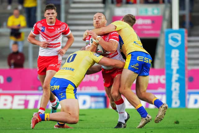 Wrapped up:  St Helens' James Roby is tackled by Hull KR's George King and Jimmy Keinhorst. Picture by Alex Whitehead/SWpix.com