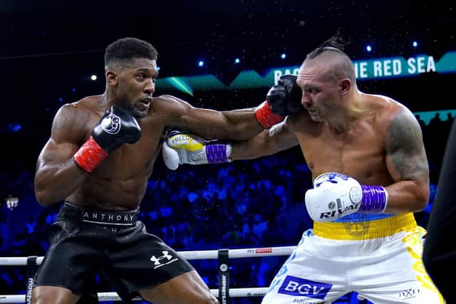 Anthony Joshua (left) and Oleksandr Usyk battle for the WBA Super IBF, IBO and WBO world titlt belts in Jeddah Picture: Nick Potts/PA