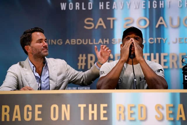 Boxing promoter Eddie Hearn comforts Anthony Joshua during a press conference following his defeat against Oleksandr Usyk in their WBA Super IBF, IBO and WBO fight at the King Abdullah Sport City Stadium in Jeddah Picture: Nick Potts/PA