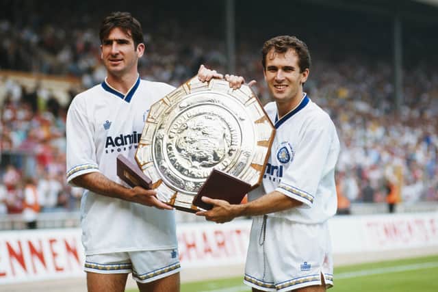 Leeds United goalscorers Eric Cantona and Tony Dorigo pose with the trophy after the FA Charity Shield between Leeds United and Liverpool at Wembley Stadium on August 8, 1992 in London, England. Leeds won the match 4-3. Picture: Ben Radford/Getty Images.