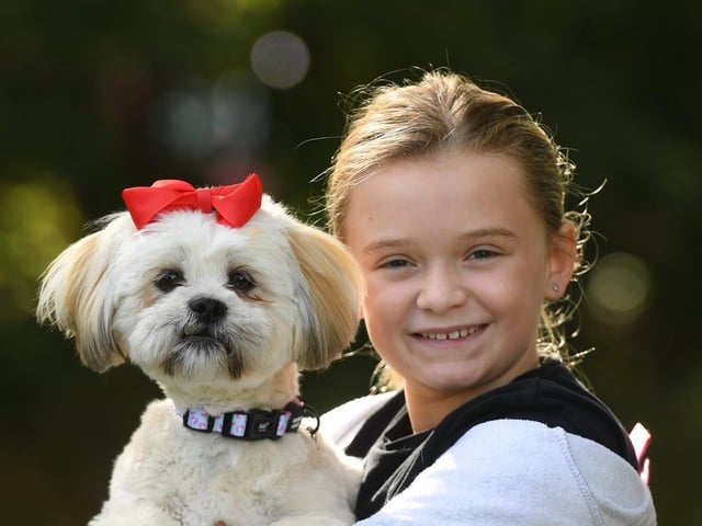 Nine-year-old Heidi Snell with her dog Martha ready for the dog show