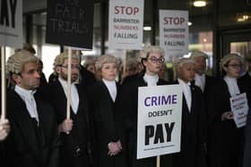 Barristers are striking over pay and working conditions.