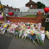 Flowers are left near to the scene of an incident lin Kingsheath Avenue, Knotty Ash, Liverpool, where nine-year-old Olivia Pratt-Korbel was fatally shot on Monday night.
