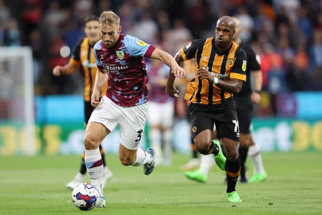 Charlie Taylor of Burnley is challenged by Oscar Estupinan of Hull City (Picture: Clive Brunskill/Getty Images)