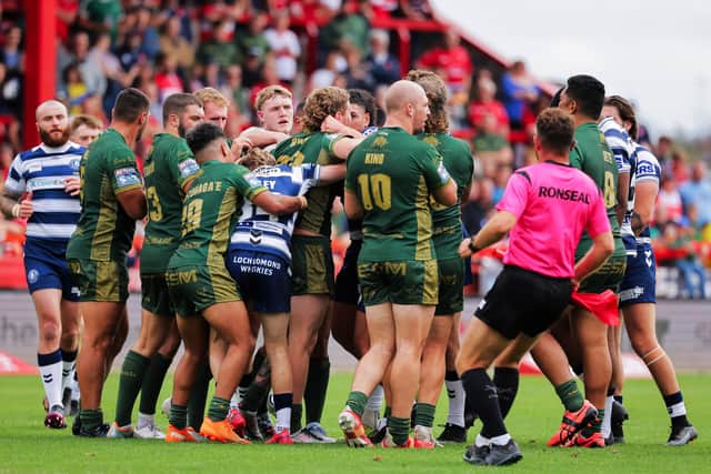 Hull KR and Wigan Warriors' players clash at Craven Park. Picture by Alex Whitehead/SWpix.com