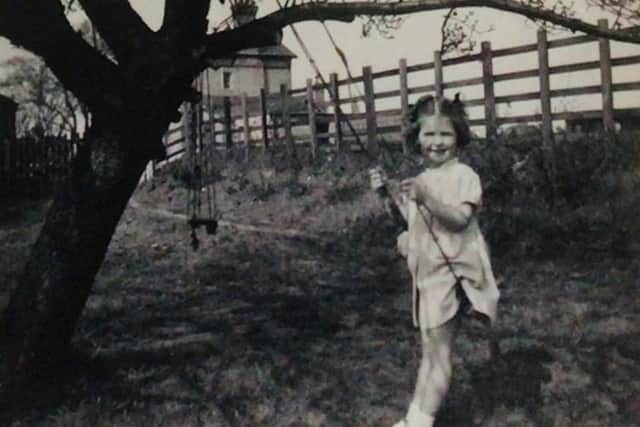 Liz Hunt playing in the station garden in the 1950s