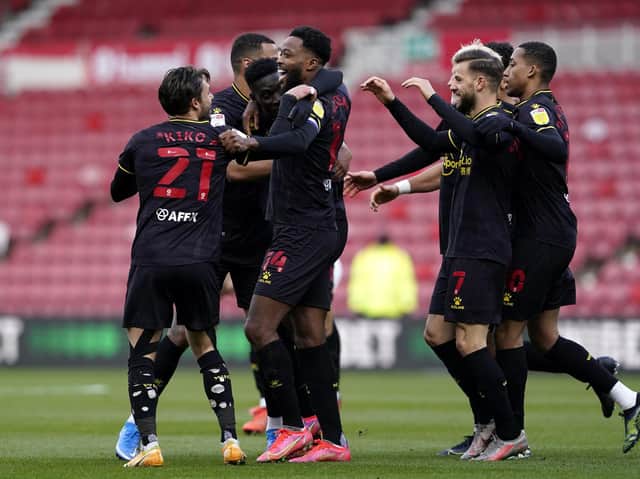 OPENER: Watford players celebrate after taking the lead at the Riverside Stadium. Picture: Owen Humphreys/PA Wire.