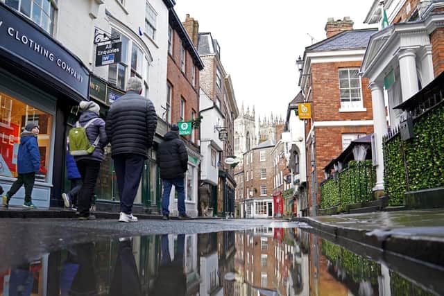 Shoppers walk through York City Centre. A planning ‘free-for-all’ which allows flats to be built in conservation areas could threaten the viability of historic city centres like York’s, a senior councillor has warned. Photo credit:  Zac Goodwin/PA Wire
